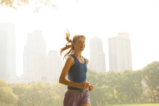 istock Woman running in urban park 166273706