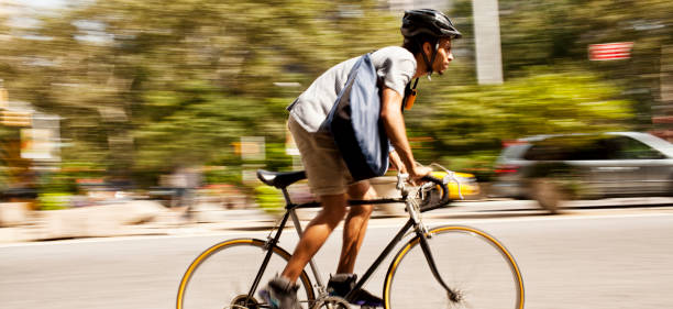 istock Man riding bicycle on city street 166273721