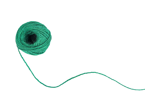 Natural green jute twine skein isolated on white background with clipping path. String, yarn ball, Hemp rope ball