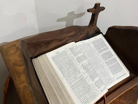 A Cross with Its Shadow and a Holy Bible
