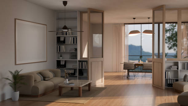 istock Interior of a spacious modern, Scandinavian living room with bifold doors through a dining room. 1662775331