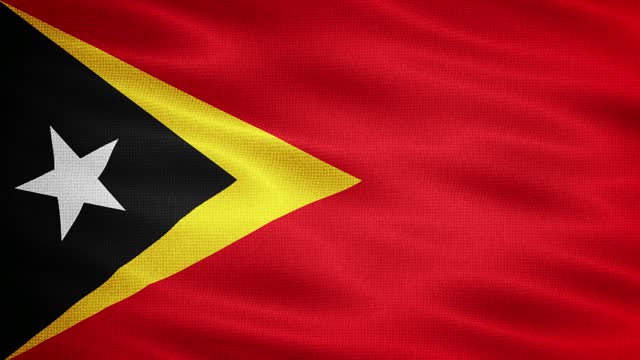 Natural Waving Fabric Texture Of Timor-Leste National Flag Graphic Background