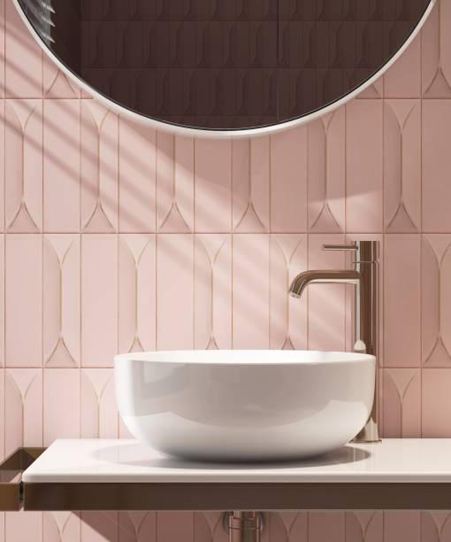 istock White stone vanity counter, modern bowl washbasin, chrome faucet, round mirror in sunlight, shadow on pink subway tile 1662804861