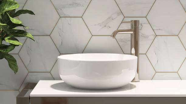 gold steel vanity counter, white stone countertop, modern washbasin bowl, chrome faucet in pastel blue hexagon tile bathroom - wastafel stockfoto's en -beelden