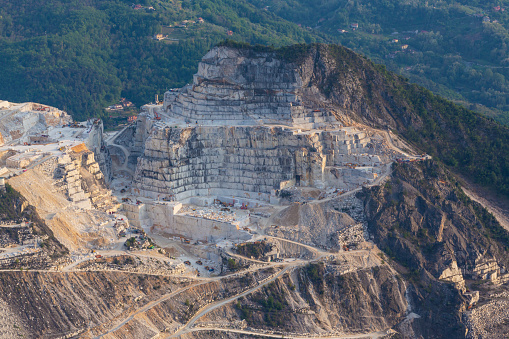 Beautiful scenery with marble quarry in Carrara region, Italy, with white marble blocks, in spring