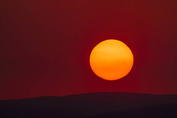 istock Sun disc with spots at sunset on a hot summer day 1662840025