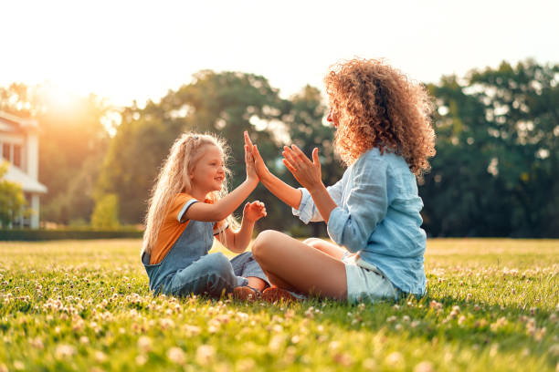 istock Happy family relaxing in the park 1662852122