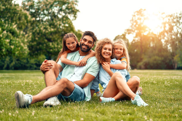 Happy family relaxing in the park