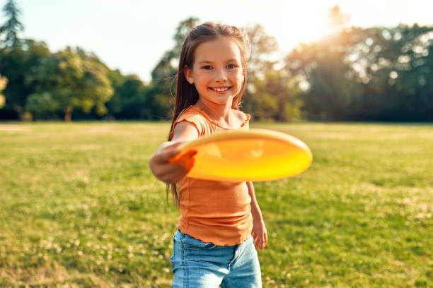 istock Happy family relaxing in the park 1662857774