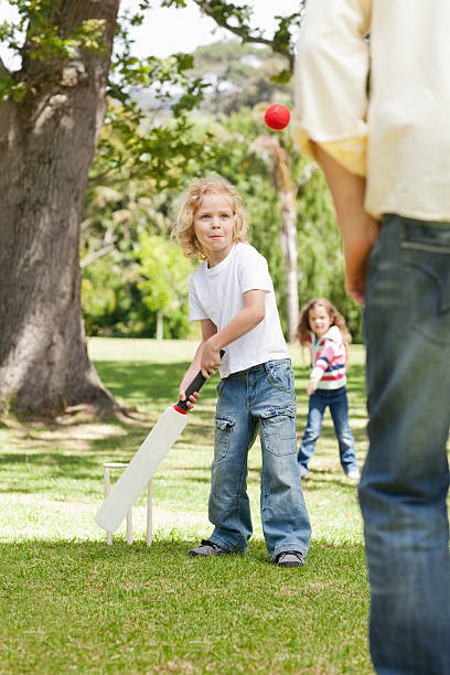 istock Boy looking ball that has been thrown by his father 166286141