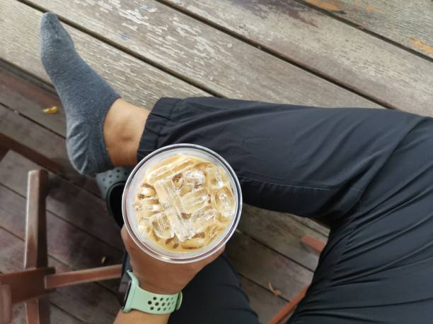 istock Selfie of iced coffee on hand 1662871566