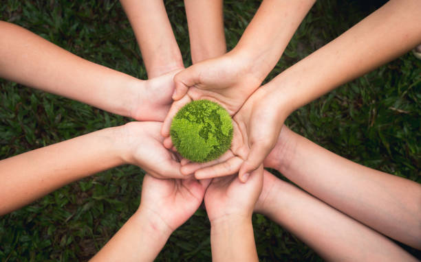 istock world environment day hand holding green globe on green background Environmental protection and sustainable environment Concept of cooperation to maintain a clean world 1662875971
