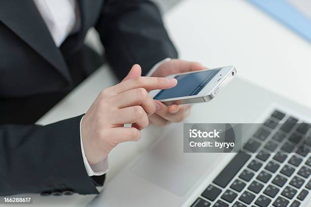 The Businesswoman Who Operates A Smartphone Stock Photo - Download Image Now - Desktop PC, Operating, Adult