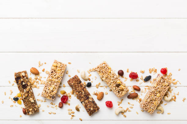 istock Various granola bars on table background. Cereal granola bars. Superfood breakfast bars with oats, nuts and berries, close up. Superfood concept 1662889020