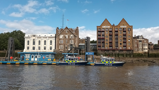 London, UK - 19th August 2023: Police boats moored on the River Thames in London, UK