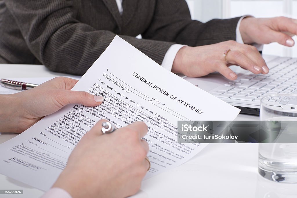 Hands of the woman signature document Hands of the woman signature document sitting on desk Abstract Stock Photo