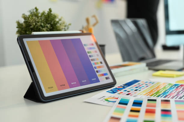istock Creative designer, Graphic at workspace with digital tablet, color swatch samples and stationery on wooden table 1662908642