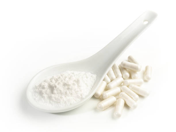 istock Manganese Powder with Capsules isolated  on white Background 1662910912