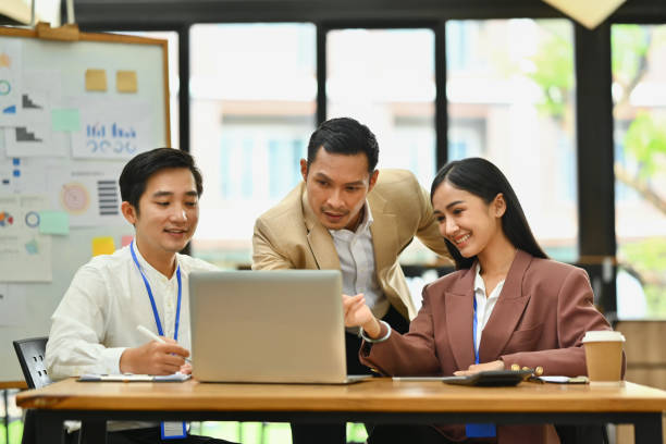 istock Businesspeople having fun cooperating working together on a new project in an office 1662911161