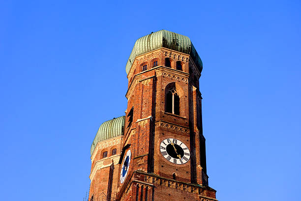 istock Steeples of Munich's Frauenkirche on a cloudless day 166291590