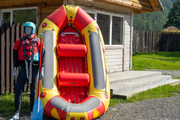 istock A mannequin in a red life jacket next to an inflatable boat 1662924924