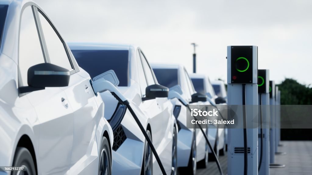 Electric Car Charging Generic electric car charging on a city street

This image doesn`t contain any visible trademarked products, corporate identity, logos, or copyrighted elements.
I am author of design of this car.
I am author of 3d model of this car Electric Car Stock Photo