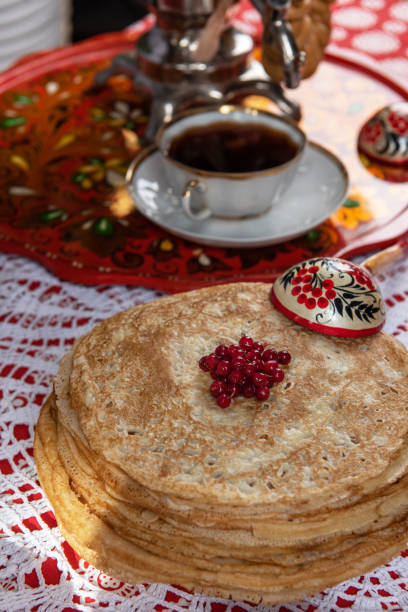 istock Russian pancake blini with berries and sour cream 1662960940