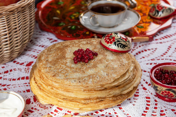 istock Russian pancake blini with berries and sour cream 1662960941