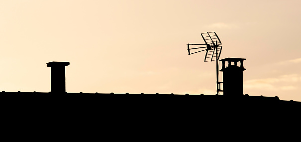 A classic TV antenna on a roof top.Similar from my portfolio: