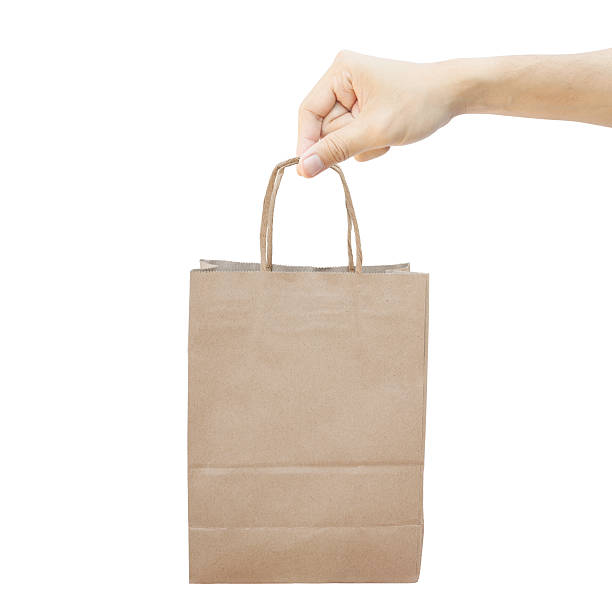 istock Hand With Paper Shopping Bag Isolated on white background 166296516