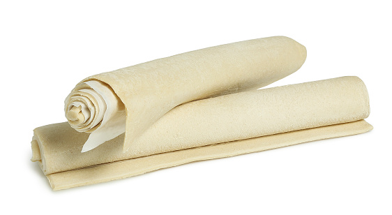 raw phyllo dough rolls isolated