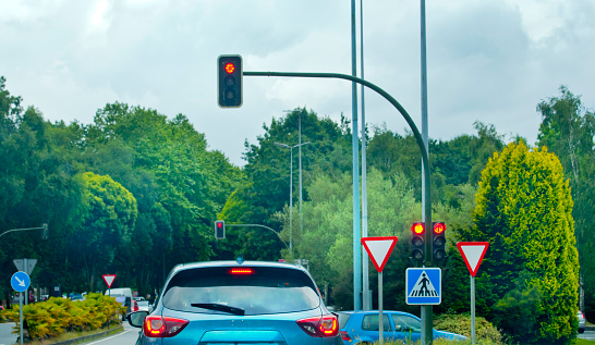 Traffic lights over urban intersection. Green light