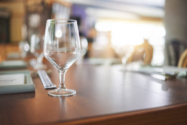 istock Bokeh, lunch and glass on a table at a restaurant for water, alcohol or wine. Dinner, crystal and tableware for a drink at a coffee shop or cafe during dinner for a luxury and fine dining experience 1663011613