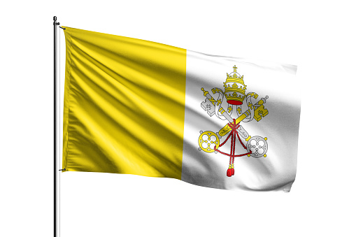 Small paper flag of Vatican City pinned. Isolated on white background. Horizontal orientation. Close up photography. Copy space.