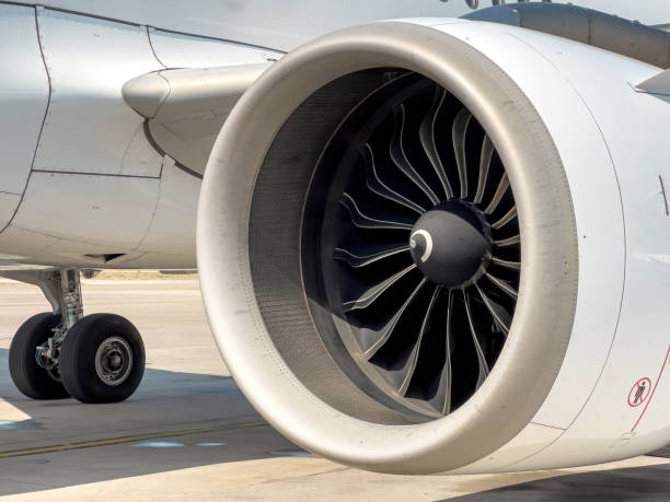 istock Jet engine under the wing of a commercial airliner standing in a parking lot 1663015789