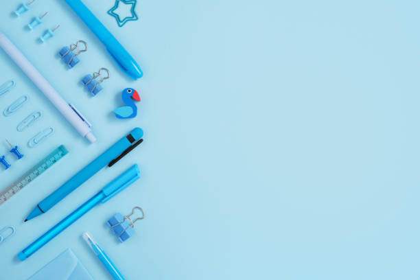 istock Frame of blue school and office stationery set on light blue background. 1663065505