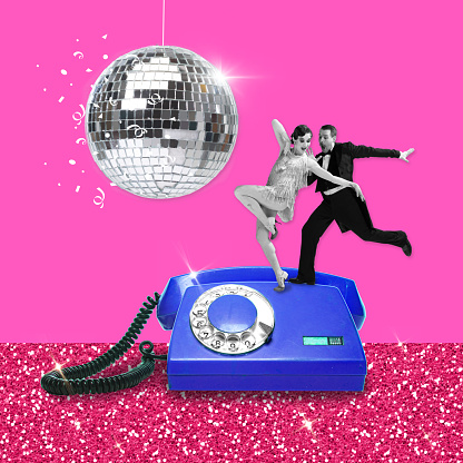 Happy, stylish, lovely young couple, man and woman in vintage costumes dancing under disco ball on retro phone. Contemporary artwork. Party, leisure time, celebration, event, joy, youth concept. Ad