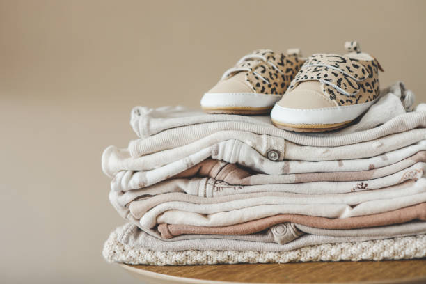 istock Stack of baby things for newborns and slippers 1663103780