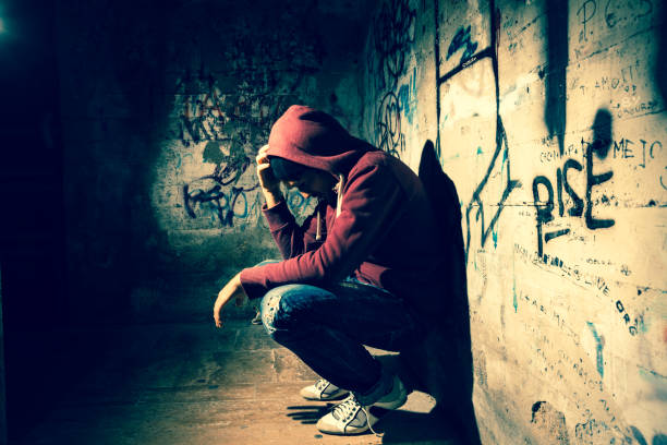 Alone in the Dark Man desperate and alone in the dark homelessness photos stock pictures, royalty-free photos & images