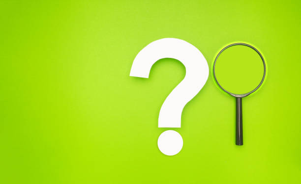 istock A magnifying glass and a white question mark symbol are on a light green background 1663114155