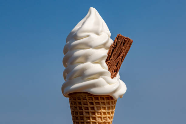 istock A close up of an ice cream cone with a chocolate flake against a blue sky 1663116286