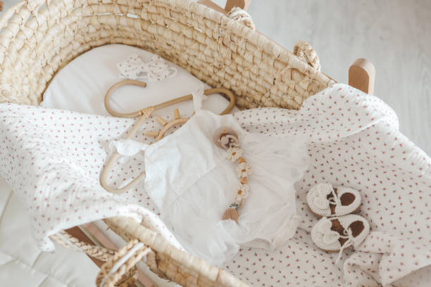 istock Outfit for a newborn in a baby cradle, concept in anticipation 1663121820