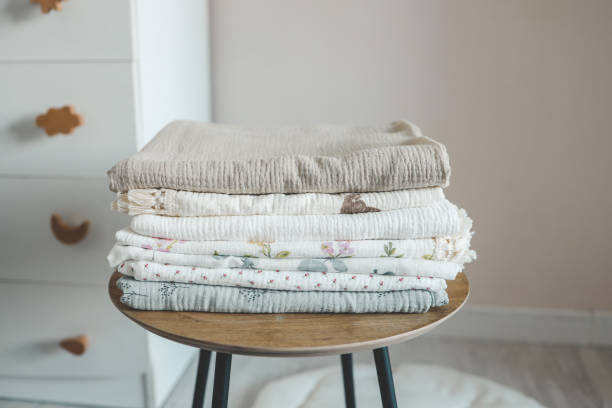 istock Stack of baby muslin blankets and newborn diapers 1663121842