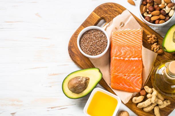 istock Healthy fats products at black background. 1663142375