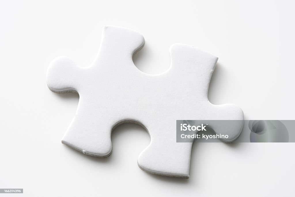 Isolated shot of blank jigsaw puzzles piece on white background Blank jigsaw puzzles piece isolated on white background with clipping path. Jigsaw Piece Stock Photo