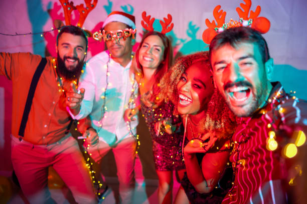 istock Friends taking selfies at New Year party 1663148214