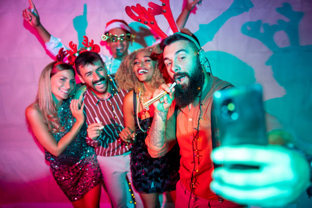 istock Friends having fun taking selfies at New Year party 1663148769
