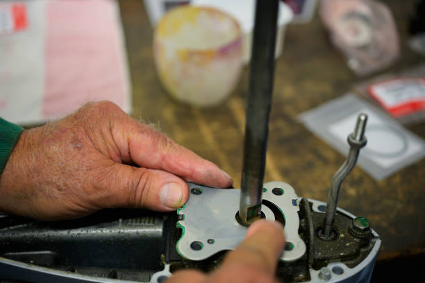 istock Close-up of Hands repairing a part of a boat engine 1663152825