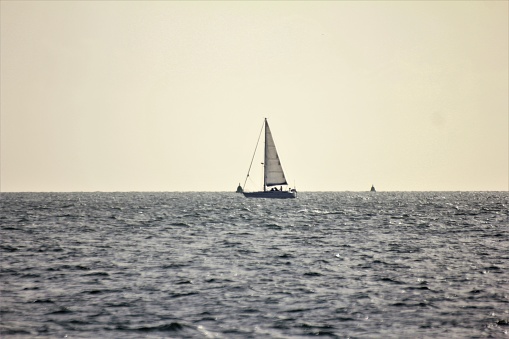 The sailing yacht rolls with a large wave during a storm in the Atlantic Ocean