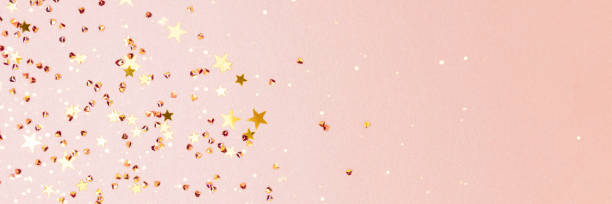 istock Banner with golden stars and crystals confetti on a pink glittering background. 1663165649